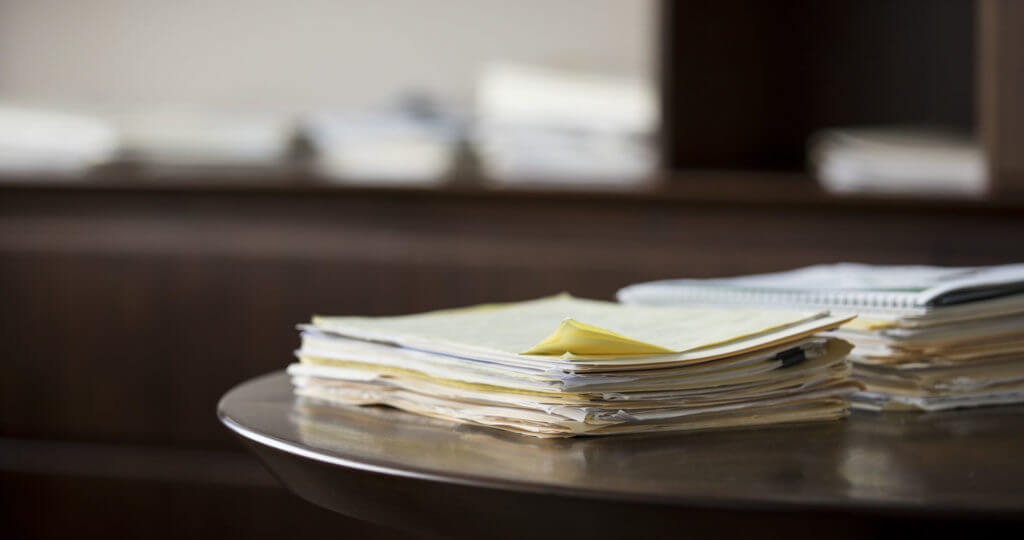 Stack of documents sitting on a table