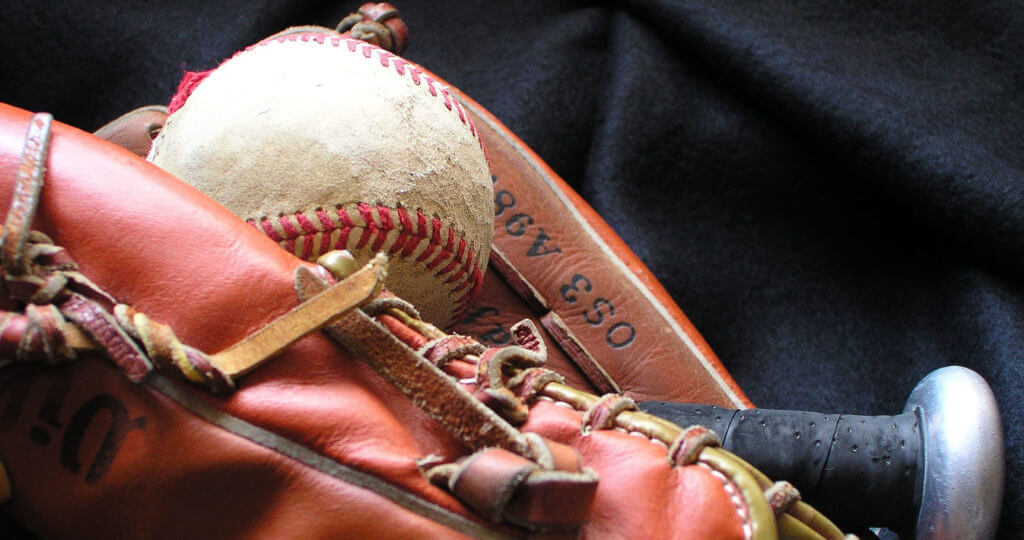 Image of a baseball, glove and bat