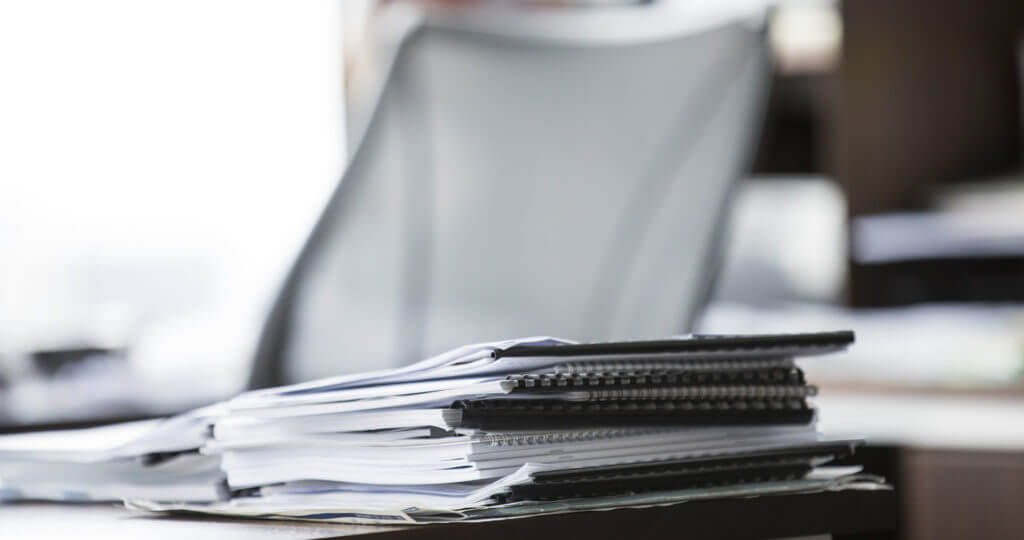 Stack of papers at a desk